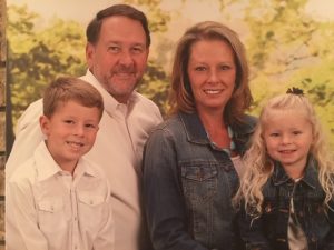 Mick Lowderman, owner of Go Green Pest Control, with his wife, son, and daughter.